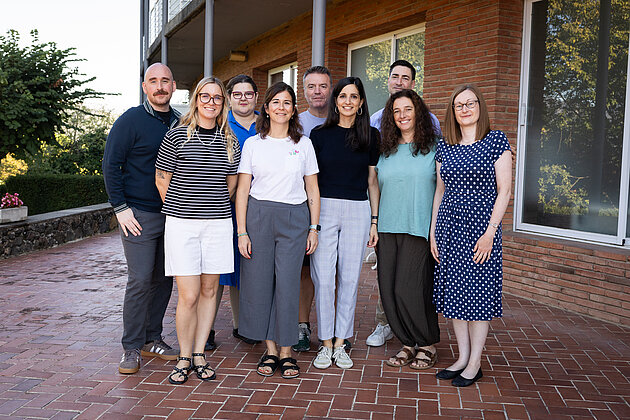 A group of people standing outside a building.